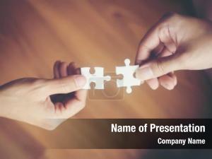 Hands Putting Puzzle Piece Together PowerPoint Template