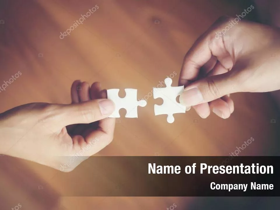 Hands Putting Puzzle Piece Together