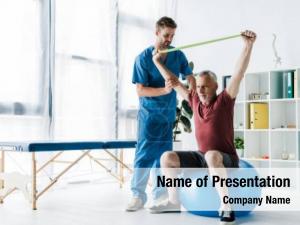 Near doctor standing middle aged PowerPoint Template