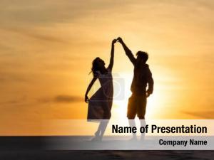 Couple Dancing On The Beach PowerPoint Template
